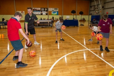 All abilities group practising basketball skills