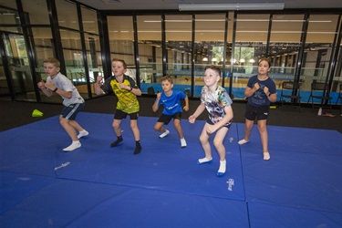 Children learn karate during the multi-sports school holiday program