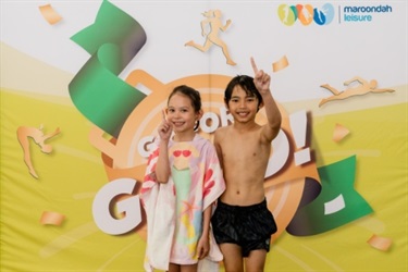 two kids with number one fingers up